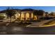 Night view of home's exterior, showcasing landscaping and entryway at 4552 S Flare --, Mesa, AZ 85212