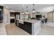 Modern kitchen with island, farmhouse sink, and stainless steel appliances at 4552 S Flare --, Mesa, AZ 85212