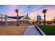 Playground with shade structures and play equipment at sunset at 4552 S Flare --, Mesa, AZ 85212