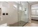 Spa-like shower with glass enclosure, built-in seat, and multiple shower heads at 4552 S Flare --, Mesa, AZ 85212