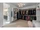 Bright walk-in closet with custom shelving, hanging rods, and a vanity area at 4552 S Flare --, Mesa, AZ 85212