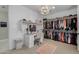 Large walk-in closet with ample shelving and hanging space, plus a vanity area at 4552 S Flare --, Mesa, AZ 85212