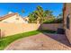 Landscaped backyard with brick patio and grassy area at 4698 W Harrison St, Chandler, AZ 85226