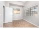 Simple bedroom with tile flooring and large window at 4698 W Harrison St, Chandler, AZ 85226