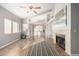 Living room with fireplace, high ceilings, and lots of natural light at 4698 W Harrison St, Chandler, AZ 85226