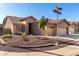 Tan two-story house with landscaped front yard and two-car garage at 5317 W Glenview Pl, Chandler, AZ 85226