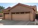 Two-car garage with attached carport and spacious driveway at 5317 W Glenview Pl, Chandler, AZ 85226