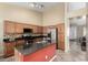 Well-equipped kitchen with granite island and stainless steel appliances at 5317 W Glenview Pl, Chandler, AZ 85226