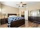 Spacious bedroom with dark wood furniture and a ceiling fan at 5350 E Deer Valley E Dr # 1279, Phoenix, AZ 85054