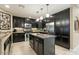 Modern kitchen with dark cabinetry, granite counters, and island at 5350 E Deer Valley E Dr # 1279, Phoenix, AZ 85054