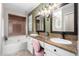 Elegant bathroom with double vanity and soaking tub at 544 W Sierra Madre Ave, Gilbert, AZ 85233