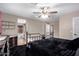 Bright bedroom with ceiling fan and ensuite bathroom at 544 W Sierra Madre Ave, Gilbert, AZ 85233