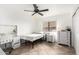 Cozy bedroom with a white dresser and ceiling fan at 544 W Sierra Madre Ave, Gilbert, AZ 85233