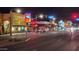 This night view showcases a vibrant commercial district, highlighting well-lit streets, eateries, and pedestrian crossings at 544 W Sierra Madre Ave, Gilbert, AZ 85233