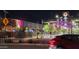 This night shot captures the lively ambiance of a commercial district, complete with restaurants, lit signage, and pedestrian walkways at 544 W Sierra Madre Ave, Gilbert, AZ 85233