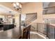 Open dining room showcasing a kitchen island and staircase at 544 W Sierra Madre Ave, Gilbert, AZ 85233