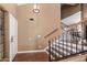 Bright entryway with hardwood floors and a staircase leading upstairs at 544 W Sierra Madre Ave, Gilbert, AZ 85233