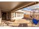 Covered patio with gravel and a decorative metal bench at 544 W Sierra Madre Ave, Gilbert, AZ 85233