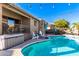 Sparkling pool with patio furniture and string lights at 544 W Sierra Madre Ave, Gilbert, AZ 85233