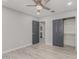 Spacious bedroom with ceiling fan, closet, and hardwood floors at 6328 N 126Th Ave, Litchfield Park, AZ 85340