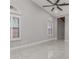 Bedroom with tile flooring, ceiling fan, and arched windows at 6328 N 126Th Ave, Litchfield Park, AZ 85340