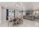 Bright dining room with a table for six and chandelier at 6328 N 126Th Ave, Litchfield Park, AZ 85340