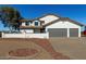 Two-story house with gray double garage and landscaped yard at 6328 N 126Th Ave, Litchfield Park, AZ 85340