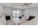 Living room with sectional sofa, ottoman, and access to balcony at 6328 N 126Th Ave, Litchfield Park, AZ 85340