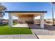 Covered patio with seating area and artificial turf at 6328 N 126Th Ave, Litchfield Park, AZ 85340