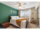 Bedroom with a green accent wall and metal bed frame at 6437 E Cypress St, Scottsdale, AZ 85257