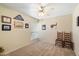 Charming bedroom with two wooden chairs and framed artwork at 6437 E Cypress St, Scottsdale, AZ 85257