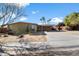 Single-story home with a carport and desert landscaping at 6437 E Cypress St, Scottsdale, AZ 85257