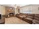 Living room with a brick fireplace and large sectional sofa at 6437 E Cypress St, Scottsdale, AZ 85257