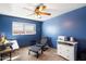 Home office space with a blue accent wall and comfortable chair at 6437 E Cypress St, Scottsdale, AZ 85257