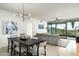 Bright dining area with modern light fixture and seating for six at 7120 E Kierland Blvd # 311, Scottsdale, AZ 85254