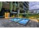 Two modern hot tubs, perfect for relaxation, in a landscaped courtyard at 7120 E Kierland Blvd # 311, Scottsdale, AZ 85254