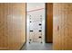 Entrance to an indoor squash court with modern wood paneling at 7120 E Kierland Blvd # 311, Scottsdale, AZ 85254