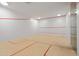 Modern squash court with hardwood floor and red lines at 7120 E Kierland Blvd # 311, Scottsdale, AZ 85254