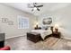 Bright bedroom with king bed and ceiling fan at 7126 E Bobwhite Way, Scottsdale, AZ 85266