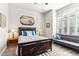 Guest bedroom with queen bed and window seat at 7126 E Bobwhite Way, Scottsdale, AZ 85266