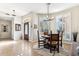 Formal dining room with a round table and leather chairs at 7126 E Bobwhite Way, Scottsdale, AZ 85266