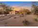 Two-story house with a desert landscape and a three-car garage at 7126 E Bobwhite Way, Scottsdale, AZ 85266