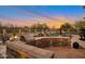 Stunning outdoor kitchen with built-in grill and seating area at 7126 E Bobwhite Way, Scottsdale, AZ 85266