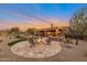 Expansive patio with fire pit and seating, perfect for entertaining at 7126 E Bobwhite Way, Scottsdale, AZ 85266