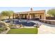 Resort-style backyard with a large pool and expansive patio at 7126 E Bobwhite Way, Scottsdale, AZ 85266