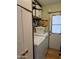 Practical laundry room with washer, dryer, and storage at 7300 N 51St Ave # F91, Glendale, AZ 85301