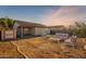 Backyard with patio furniture and shed at 7334 S Morning Dew Ln, Buckeye, AZ 85326