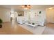 Living room with white couch and coffee table at 7334 S Morning Dew Ln, Buckeye, AZ 85326