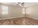 Spacious bedroom with wood-look floors and two windows at 7432 E Melrose St, Mesa, AZ 85207