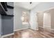 Bright bedroom with wood-look floors and large window with shutters at 7432 E Melrose St, Mesa, AZ 85207